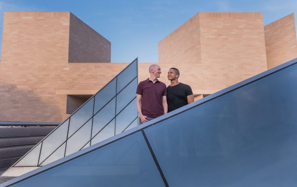 Gay engagement shoot in front of the Glass Pyramids at the National Gallery of Art in Washington, DC.