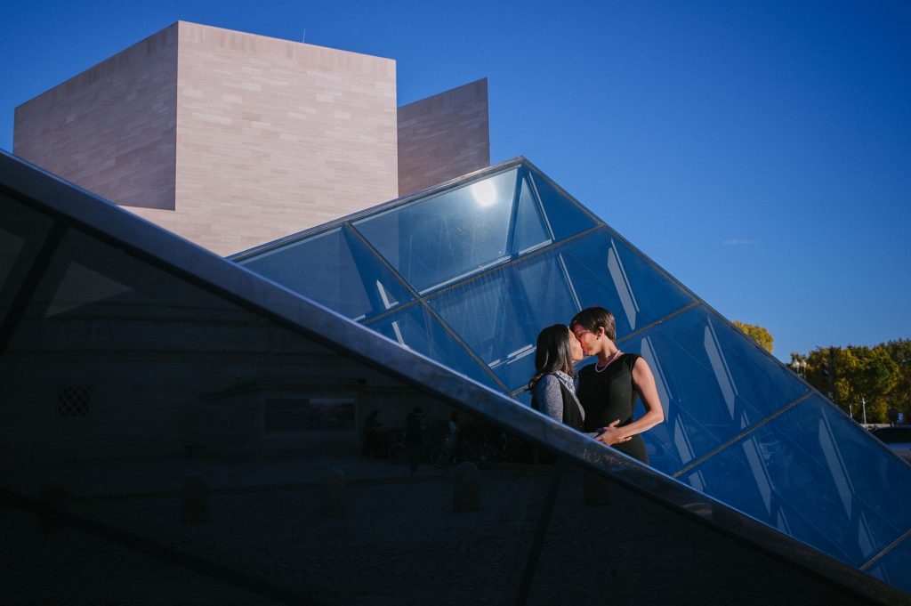 Lesbian engagement shoot in front of the Glass Pyramids at the National Gallery of Art in Washington, DC.