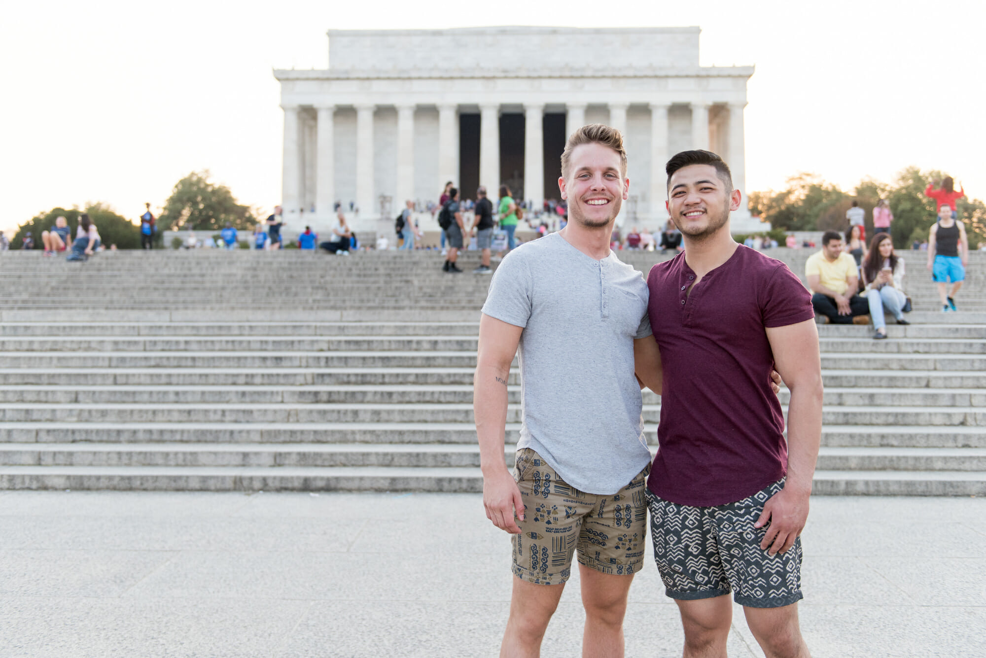Gay LGBT couple posing in front of the Lincoln Memorial on the National Mall in Washington, DC